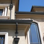 California Dreamin' Copper Gutter, Eclipse Millennium Cast Bronze Leaderhead And 3" Cast Bronze Fleur-de-lis Downspout Strap Copper Gutter 10-1